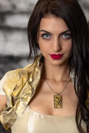 Model wearing Canvas Bolero, crafted from oil-painted fabric using the crumpled sewing application technique. Front view.