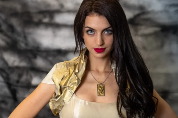 Model wearing Canvas Bolero, crafted from oil-painted fabric using the crumpled sewing application technique. Front view.