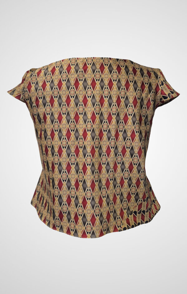 Astrum Sericum pure silk top with asymmetric gold, burgundy, and black geometric print.