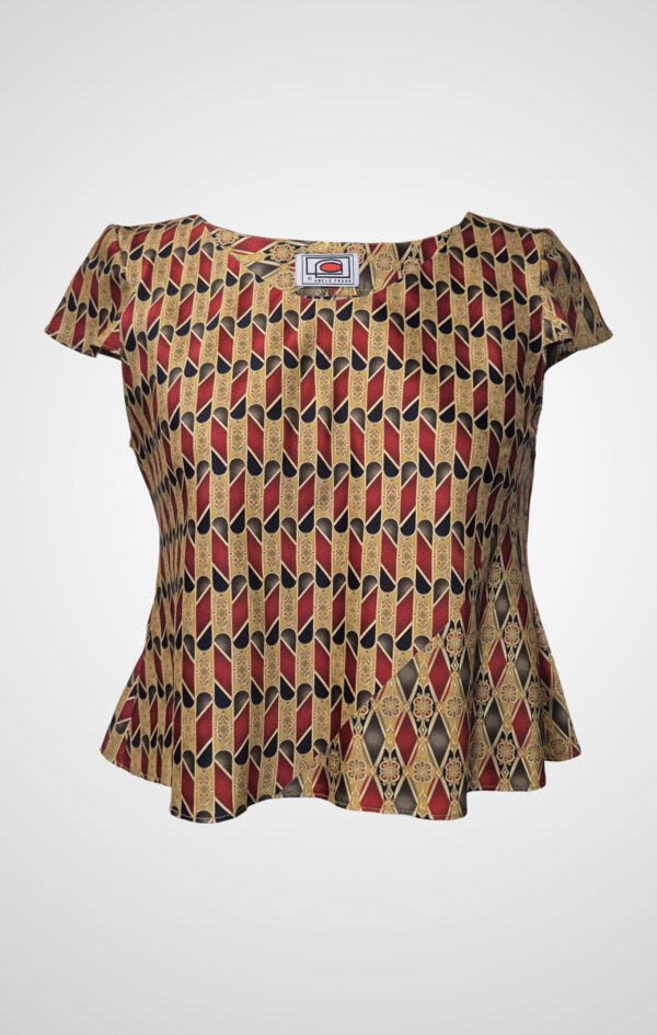 Astrum Sericum pure silk top with asymmetric gold, burgundy, and black geometric print.