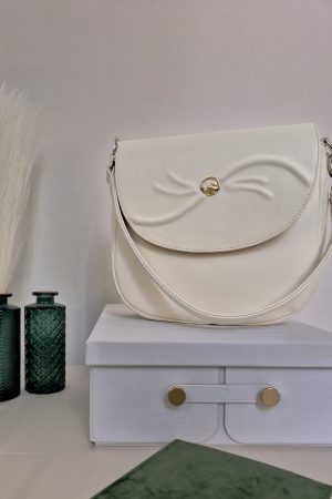 Adele Frank Luminis saddle bag with 14 karat gold Yin-Yang button design.