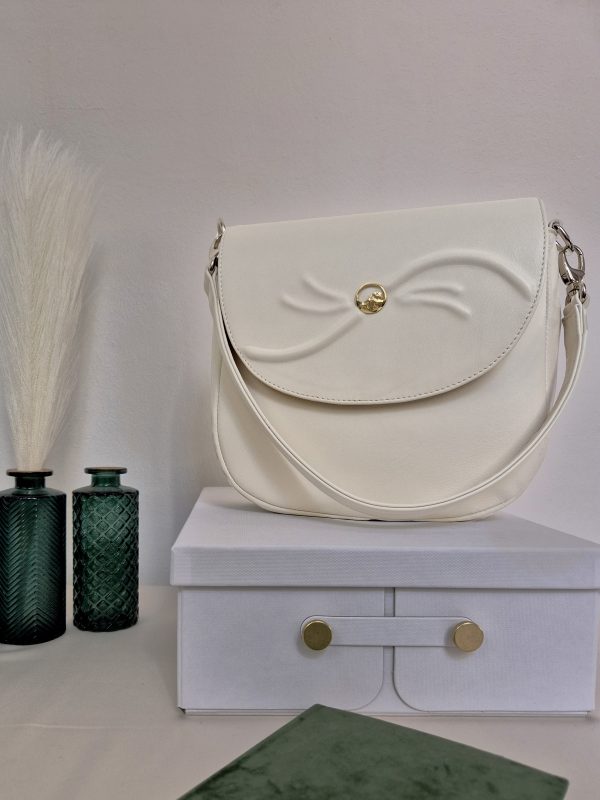 Adele Frank Luminis saddle bag with 14 karat gold Yin-Yang button design.