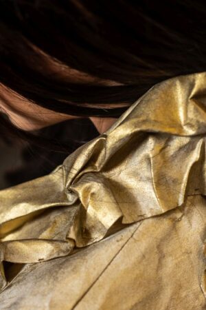 Detail of the Canvas Bolero, crafted from oil-painted fabric using the crumpled sewing application technique.
