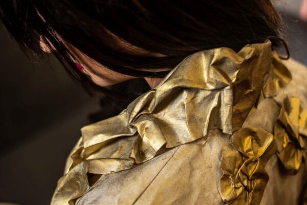 Detail of the Canvas Bolero, crafted from oil-painted fabric using the crumpled sewing application technique.