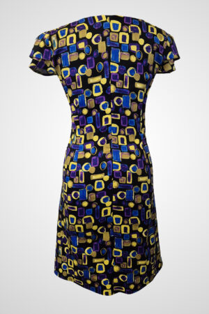 Back view of the Flos Umbrae Pleated Sleeve Dress, showing the clean lines and sleeve construction from a different angle.