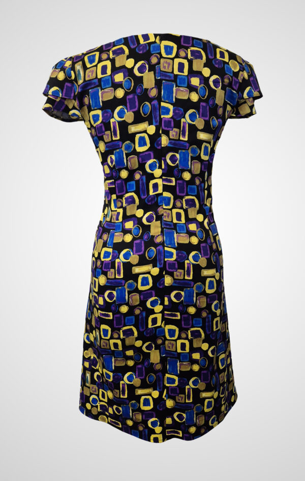 Back view of the Flos Umbrae Pleated Sleeve Dress, showing the clean lines and sleeve construction from a different angle.