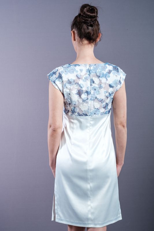 White dress, with blue flower patterned embroidery