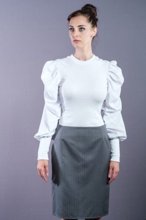 White shirt with puffed sleeves and power shoulders