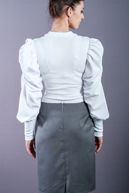 White shirt with puffed sleeves and power shoulders