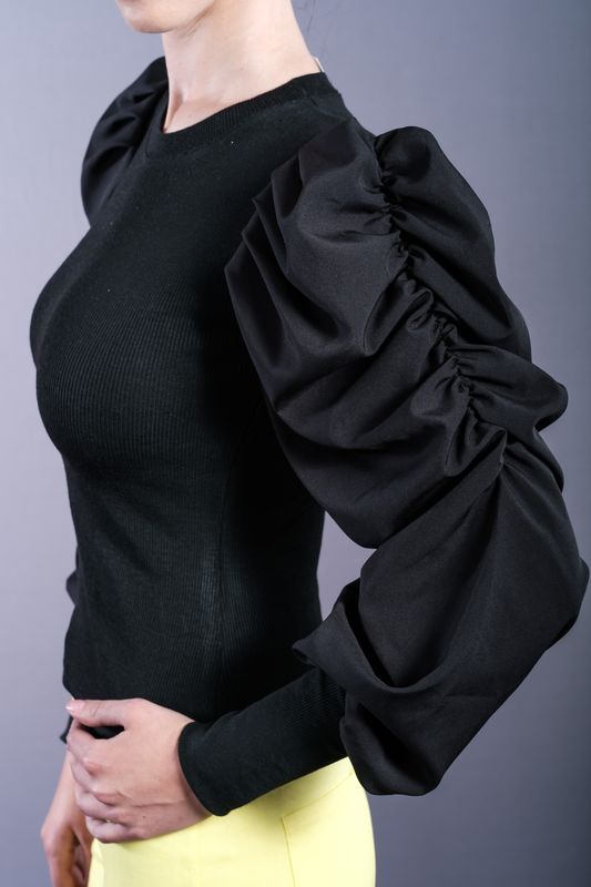 Black shirt with puffed sleeves and power shoulders