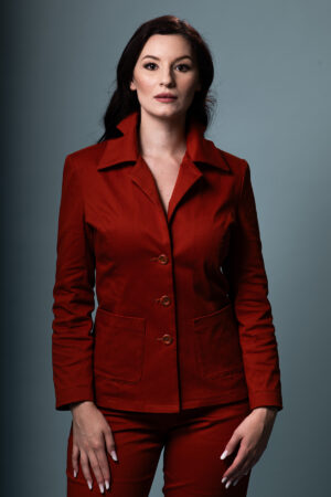 Terracina tailored pantsuit in terracotta with sharp lapel, front view.