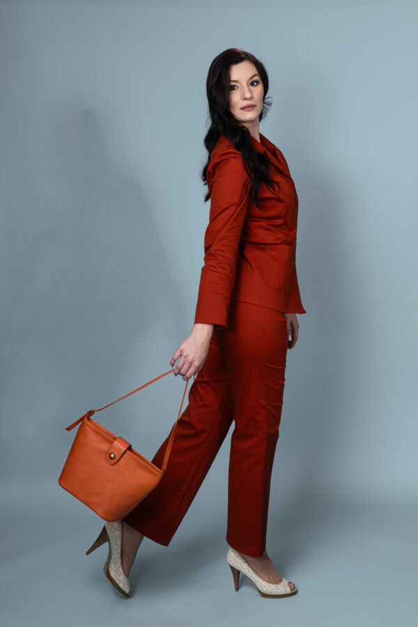 Flamma bucket bag in smooth orange leather with a unique sgraffito-enamel button.