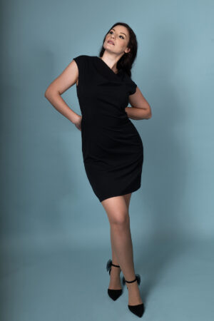 Styled shot of Nocturna Elegantia dress, capturing its elegant silhouette and draped neckline.