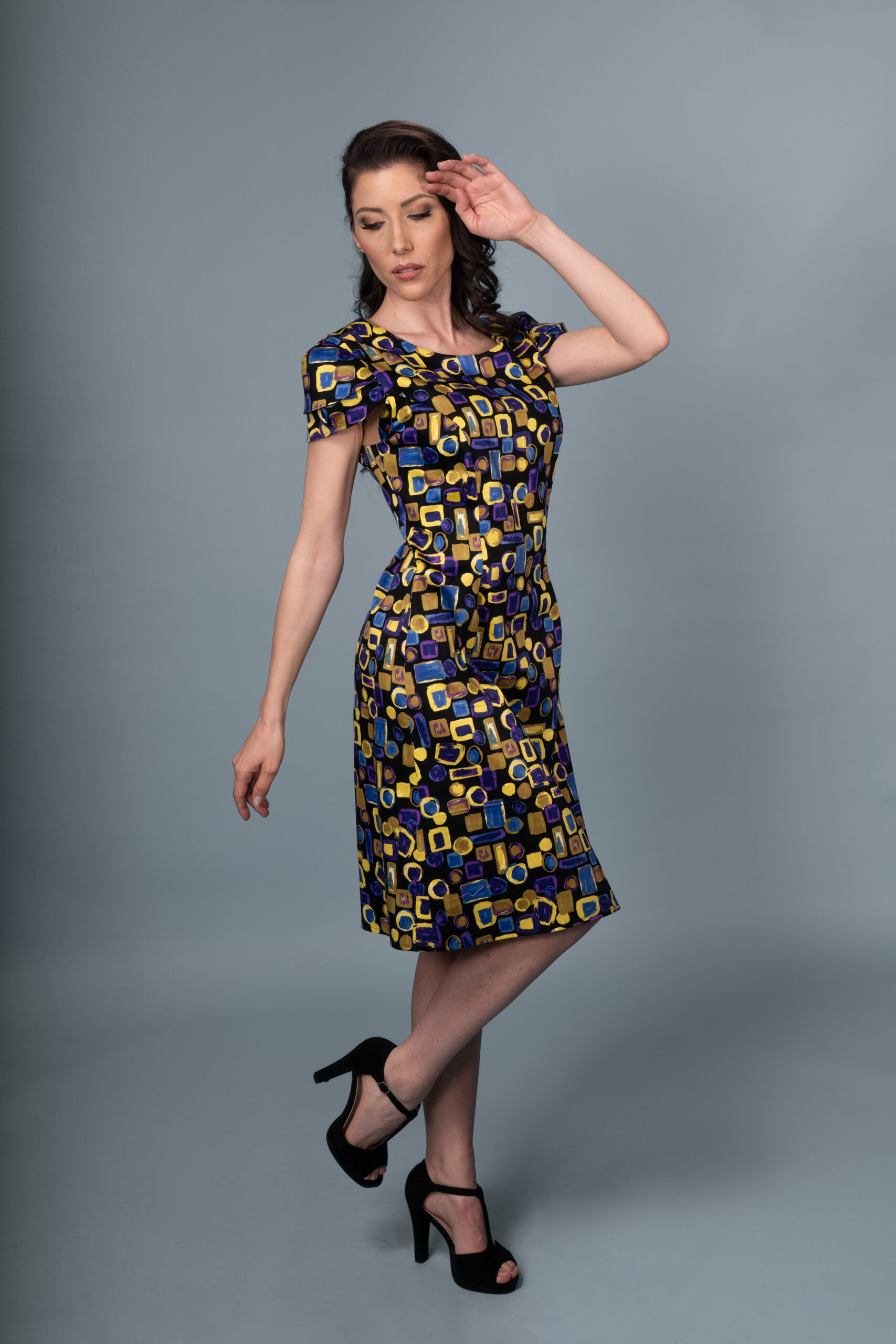 Flos Umbrae Pleated Sleeve Dress ull-length shot, capturing the dramatic sleeves and flattering A-line silhouette.