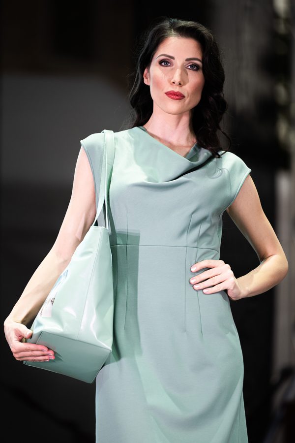 Model carrying the Wild Runway Leather Bag by Adele Frank at Porcelain Doll Fashion Show.