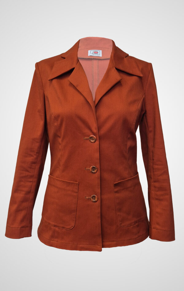 Terracina tailored pantsuit in terracotta with sharp lapel, front view.
