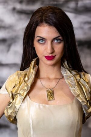 Model wearing Canvas Bolero, crafted from oil-painted fabric using the crumpled sewing application technique. Front view.